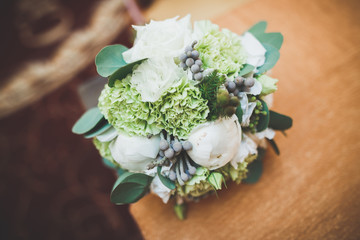 Beautiful wedding bouquet with different flowers, roses