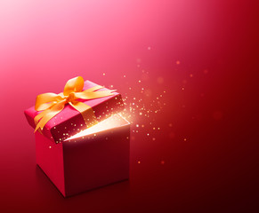 Red open gift box with glittering