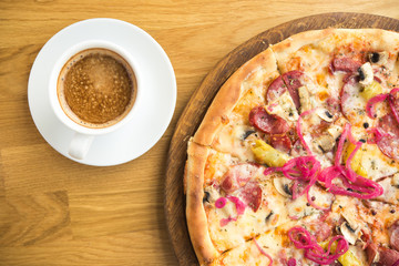 tasty italian pizza with cheese, pickled onion, mushrooms and salami