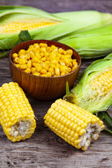 Ripe corn on a wooden table.