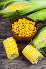 Ripe corn on a wooden table.