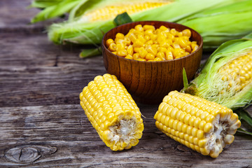 Ripe corn on a wooden table.