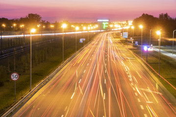 Fototapeta na wymiar light trails on motorway highway at night, long exposure