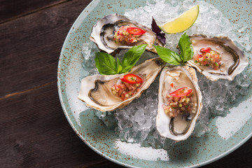 Open oyster stuffed with papper and lemon