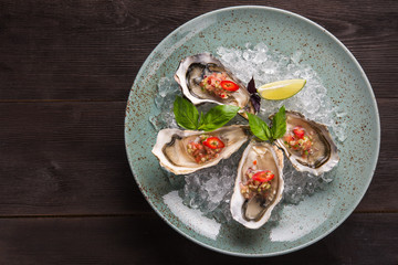 Open oyster stuffed with papper and lemon