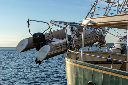 The boat is suspended at the stern of the ship