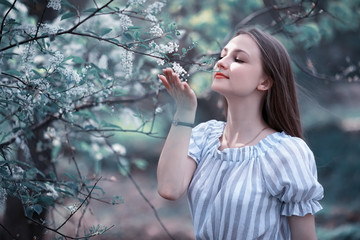 A girl in a spring green park