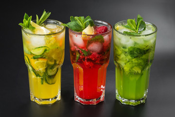 Fresh cocktail with cucumber, raspberries and kiwi