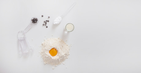 preparation of a cake on wooden white background