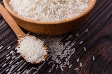 Jasmine rice on a wooden rustic background
