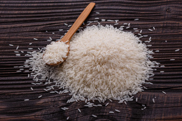 Jasmine rice on a wooden rustic background