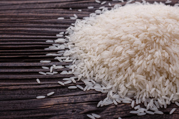 Jasmine rice on a wooden rustic background