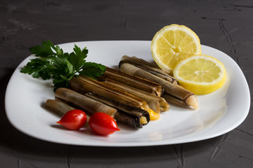 Fresh seafood with herbs and lemon, italian cuisine, mediterranean food.