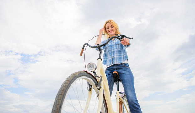 How cycling changes your life and make you happy. Mental health benefits. Pedaling towards happiness. Girl rides bicycle sky background. Woman feels happy while enjoy cycling. Reasons to ride bicycle
