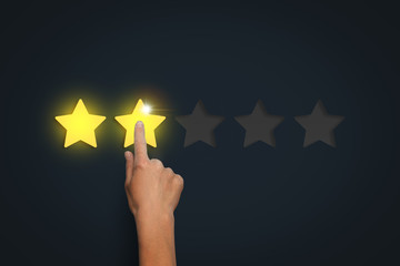 Female hand leaves a rating of two stars out of five possible ag