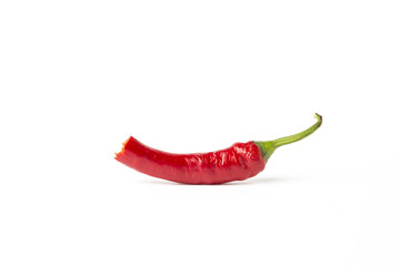 Bitten red hot chili pepper on an isolated white background. The