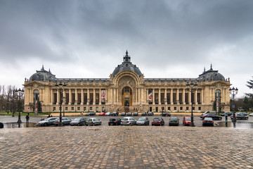 Fototapeta na wymiar Facade of the Great Palace (Grand Palais) on a cloudy day in Paris, France, on February 20, 2014