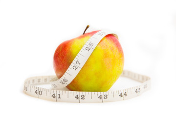 apple and centimeter on white background. Isolated on white.