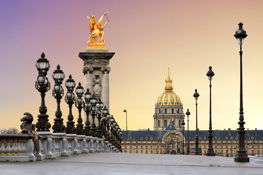 Fototapeta Beautiful sunrise at the Pont Alexandre III and Les Invalides in Paris