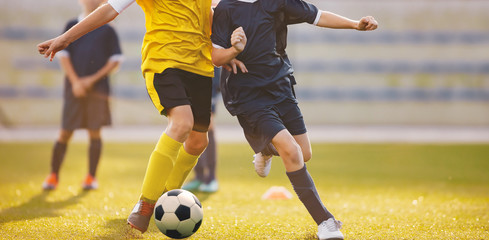 Football match at the stadium. Soccer players competing in summer sunlight. © matimix