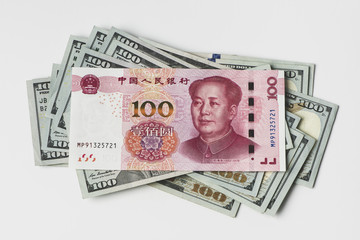 US dollar bill and Chinese yuan banknote. USD vs RMB.