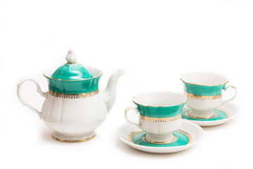 set of dishes on white background. Cups and kettle. Indian set.