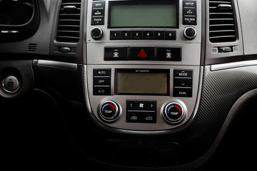 Modern luxury prestige car interior, dashboard, steering wheel.