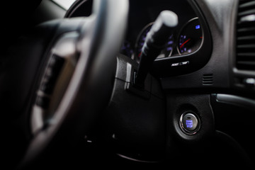 Fototapeta na wymiar Detail on the start button in a car. Car interior, key, start&st