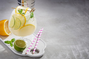 Cold refreshing summer lemonade mojito in a glass.