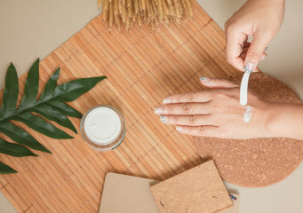 Woman applying moisturizing cream treatment Test cosmetic on hands.Beauty And Make-up Concept