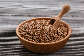 raw lentils on a wooden rustic background