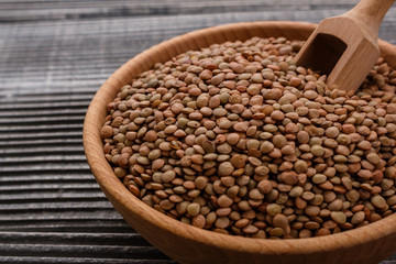 raw lentils on a wooden rustic background