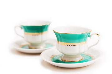 set of dishes on white background. Green indian cups