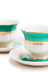 set of dishes on white background. Green indian cups