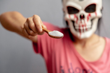 The dangers of sugar in Halloween day Concept . warned that the sugar too much will make unhealthy...