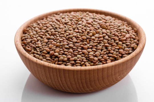 Raw Lentils On A White Acrylic Background
