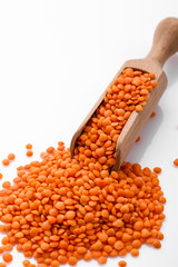raw lentils on a white acrylic background