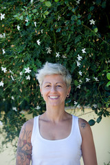 Woman with flowered tattoos on her arm