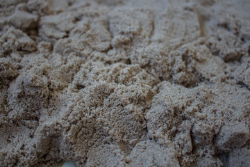 the grey sand scattered on the table