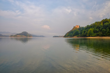 Fototapeta na wymiar Scenic view of artificial Czorsztynskie Lake and Czorsztyn Castle in Southern Poland
