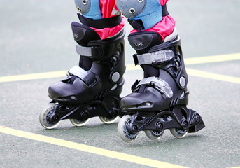 Fototapeta na wymiar child rollerblading outdoor. sport lifestyle. roller skating
