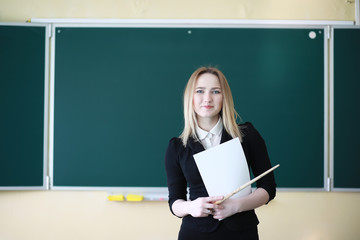 Young girl teacher in primary school