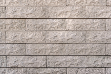 A wall of brown stone. Stone wall texture background natural color