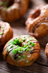 Fresh doughnuts on wooden table