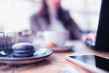 Girl eating coffee cakes