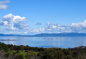 View from the top of the hill. The nature of Norway. The island of Rennesoy.View of the sea. Blue sky. Sunny day.