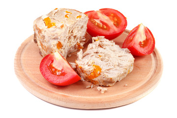 Wooden plate isolated with cold boiled pork meat with carrot and tomatoes