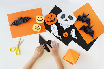 Lesson of origami. creativity. Hands of kids.