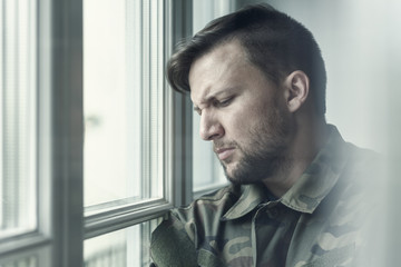 Sad and lonely soldier in depression after war with emotional problem