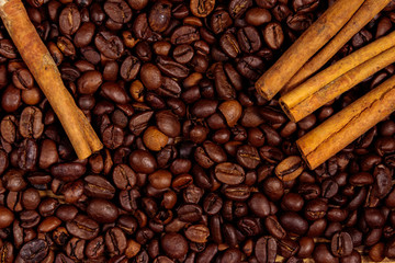 Roasted coffee beans and cinnamon sticks